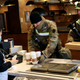 armed national guard members getting coffee